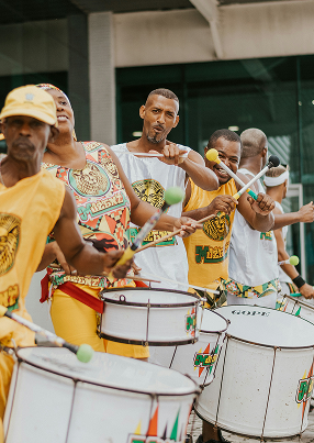 Jamaican drummers performing by the sea